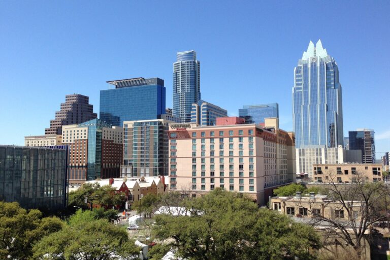 An urban city with tall towers and buildings